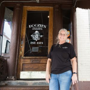 image of Monica standing on steps to Boozies