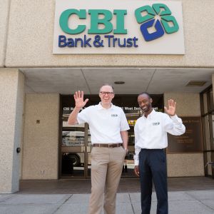 image of cbi bank and trust staff outside of bank