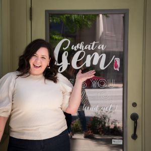 image of sarah outside what a gem doorway