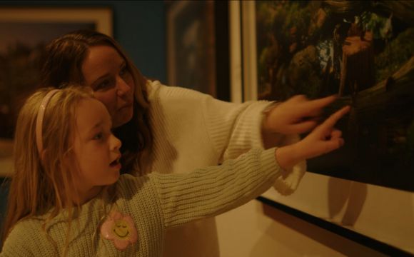 Mom & Daughter Looking at Paintings