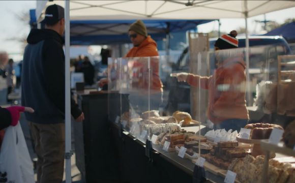 display case of bread at farmers market