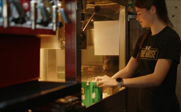 A lady serving popcorn