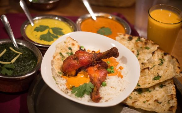 plate of chicken and assorted sides