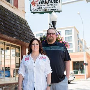 image of jane and matt standing outside of business