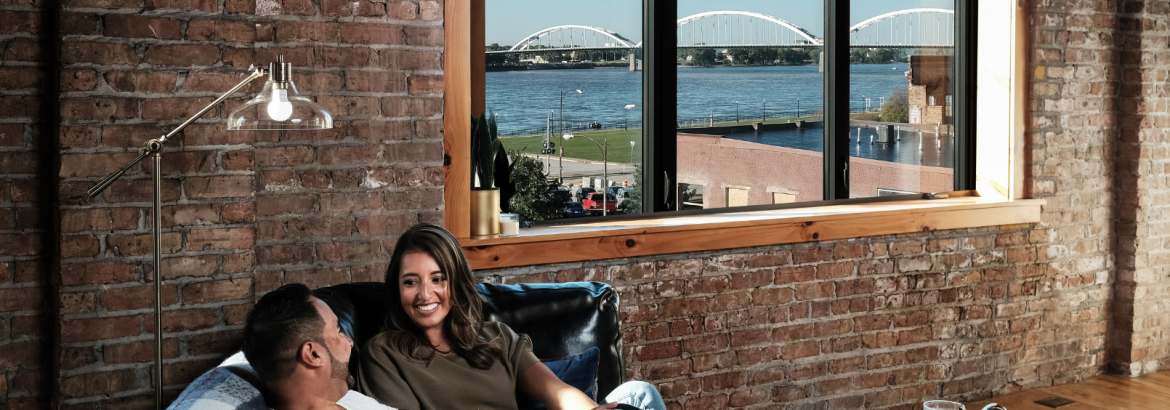Image of couple relaxing in a downtown davenport apartment