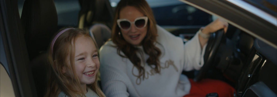 Woman driving around daughter downtown